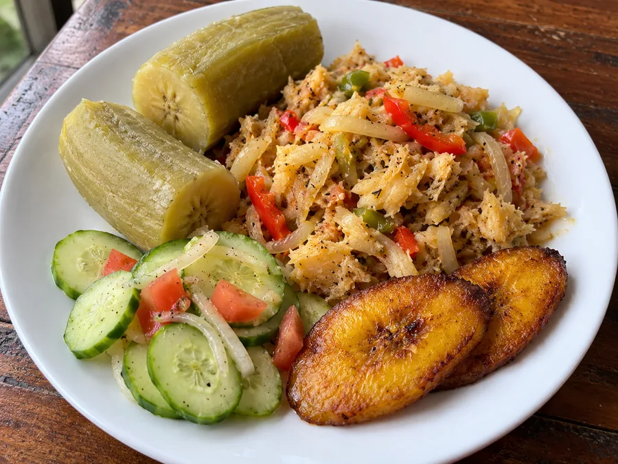 Green fig and saltfish with cucumber salad and plantain